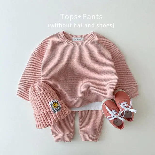 MilkBabyCo’s Cotton light pink long sleeve ribbed sweater and matching pants set for infant babies and toddler in pink, perfect for autumn fall or winter fashion.