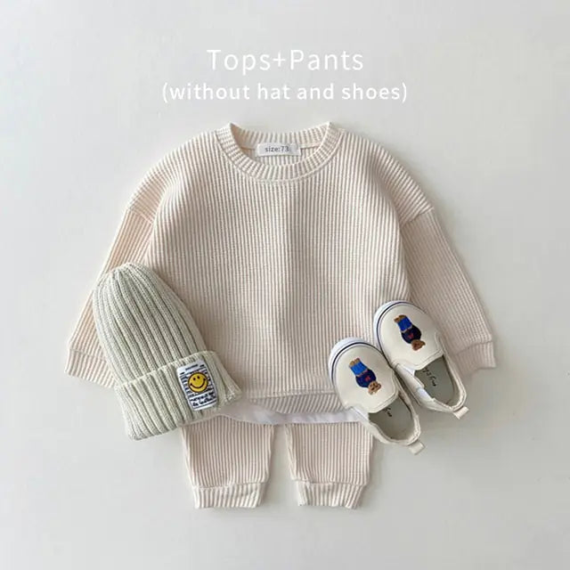 MilkBabyCo’s Cotton Beige long sleeve ribbed sweater and matching pants set for infant babies and toddler in pink, perfect for autumn fall or winter fashion.